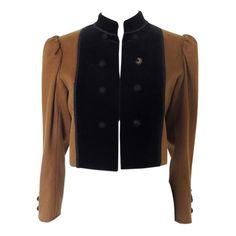 This is a vintage YSL Rive Gauche brown wool jacket. I believe this is a "Russian Collection" piece, late 1970s. The jacket has puff sleeves, Mandarin collar and black Passementerie trim. I believe this is wool with velvet paneling. The jacket is tagged size 36. Made in France. The jacket is in fair vintage condition. While the jacket body, trim, and velvet panels are in good condition, there are issues with several of the buttons and their net coverings. One cuff is missing one button, and the Retro Evening Outerwear For Fall, Retro Fall Evening Outerwear, Brown Winter Evening Outerwear, Vintage Outerwear For Evening In Fall, Brown Long-sleeved Outerwear For Evening, Vintage Evening Blazer For Winter, Brown Long Sleeve Outerwear For Evening, Brown Long Sleeve Evening Outerwear, Vintage Brown Wool Blazer