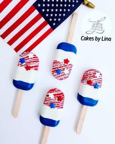 three patriotic popsicles on a stick with an american flag and cake by linga