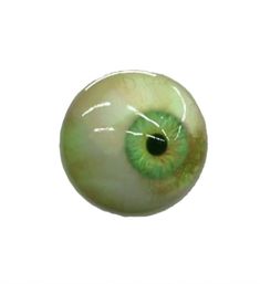 an eyeball with green and yellow colors on the outside is shown in front of a white background