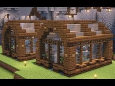 a small house made out of wood and stone in the middle of a minecraft village