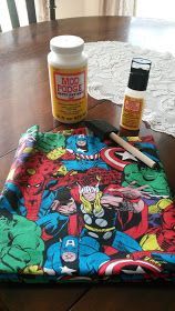 the table is covered with various items to make it look like they are in comics