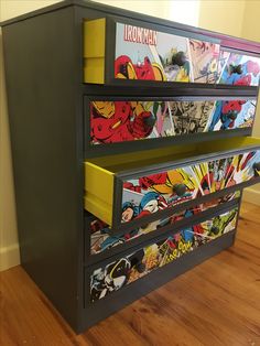 a dresser with comic themed drawers on it's front and side panels painted yellow