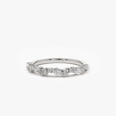 a white gold wedding band with five diamonds