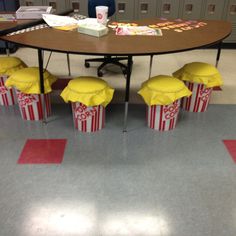 a table with some popcorn boxes on it