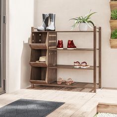 a wooden shelf with shoes on it in front of a door and steps leading to the outside