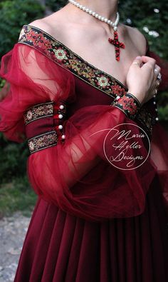 Renaissance inspired burgundy dress. This design was created by me and I made the patterns. The top has an off the shoulder boat neckline and an X in the front featuring a beautifully decorated trim which goes all around the back. The same trim decorates the cuffs and the sleeves. Fantasy Dresses, Medieval Dress, Crimson Red, Beauty Dress, Gothic Dress, Historical Costume, Cosplay Dress, Fairy Dress