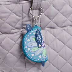 Keep track of your AirPods or other small items with this charm that clips right onto any bag or backpack. Polyurethane Hinge ring. Dimensions: 3. 75" w x 2. 5" h x 0. 75" d Vera Bradley Outlet Beach Coin Purse with Zip Closure Bag Charm Keychain in Turtle Dream Beachy Bag, Wristlet Keychains, Hinged Ring, Black Leather Bracelet, Bag Charms, Charm Keychain, Woman Beach, Purse Bag, You Bag