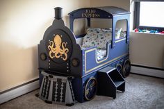 a child's train bed with an octopus on it