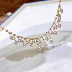 Highline: Unique style Product Information OriginJapan MaterialBaby Akoya Pearl and 18k Gold DimensionsNecklace Length 45cm Pearl Shaped: Round Size: 3-4 mm Quality: AAAA Nacre: Very Thick Color: White Luster: Aurora Accessories Metal: 18k Gold Other: Including 18k Gold/45 cm Chain Yellow Gold Round Pearl Necklace With Adjustable Chain, Gold Akoya Pearl Necklace Fine Jewelry, Dainty Akoya Pearl Necklace In Yellow Gold, Yellow Gold Dangle Necklace With Pearl Drop, Dainty Yellow Gold Akoya Pearl Necklace, Yellow Gold Akoya Pearl Briolette Necklace, Yellow Gold Dangle Pearl Necklace Gift, Beaded Jewelry Necklaces, Making Stuff