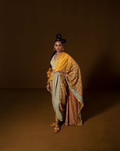 CHAKRA PHOOL SARI YELLOW : this summer silk sari is pre-draped , with hand embroidery along the borders and pallu . The blouse is corsetted and fully hand embroidered using intricate sequin. Fabric : summer silk + lycra olive mustard Color 15 DAYS Delivery DRYCLEN ONLY DRYCLEN ONLY, STORE IN PLASTIC GARMENT BAGS FOR THE PRINT TO RETAIN SHINE 3 Components Bollywood Style Pre-draped Saree In Raw Silk, Yellow Pre-draped Saree With Resham Embroidery, Yellow Tussar Silk Anarkali Sets, Bollywood Style Yellow Pre-draped Saree For Navratri, Yellow Bollywood Pre-draped Saree For Navratri, Yellow Chanderi Choli With Traditional Drape, Traditional Drape Yellow Chanderi Choli, Yellow Resham Embroidered Pre-draped Saree For Festivals, Yellow Pre-draped Saree With Resham Embroidery For Navratri