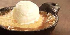 a scoop of ice cream sitting on top of a skillet