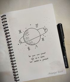 a notebook with an image of the planet and its name written in cursive writing