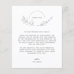 the wedding thank card is shown in black and white with an elegant wreath design on it