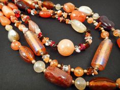 Summery color palette of gorgeous polished multi-strand beaded necklace comprised of Carnelian, Citrine, Yak bone and glass beads for your favorite sun goddess! 32 inches long and finished with a white brass lobster claw clasp on a 2.5 inch adjustable chain. Bohemian Amber Multi-strand Beaded Necklace, Amber Multi-strand Beaded Necklaces For Jewelry Making, Frog Necklace, Sun Goddess, Multi Strand Beaded Necklace, Carnelian Necklace, White Brass, Multi Strand Necklace, Sell Items