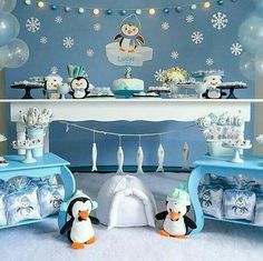 a penguin themed birthday party with balloons and decorations