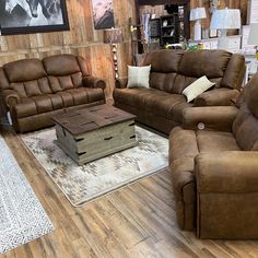 a living room with two couches and a coffee table