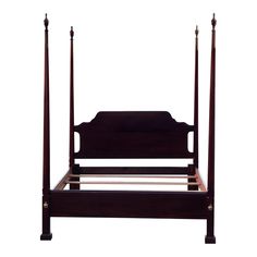 a wooden bed frame with four posts and no headboard or foot board is shown