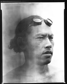 a man with goggles on his head and swimming goggles over his eyes is shown in this black and white photo