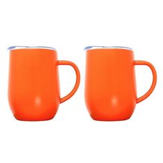 two orange coffee mugs sitting next to each other