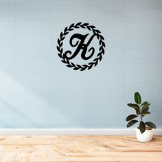 Custom monogrammed wreath with custom family name letter Styling Iron Monogram Letter Wreath, Custom Metal Signs Door, Custom Last Name Signs Metal, Metal Monogram Sign Front Doors, Family Last Name Metal Sign, Fence Wall, Backlit Signs, Gold Powder, Monogram Wreath