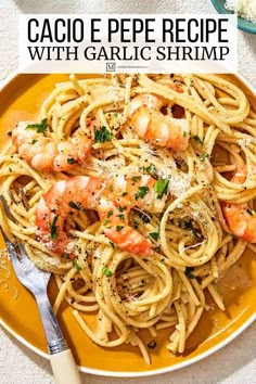 a plate of pasta with shrimp and parmesan cheese on top, next to a fork