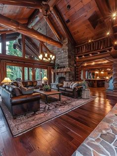 a large living room with wood floors and high ceilings