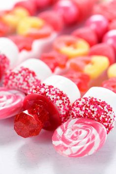 there are many candy candies with sprinkles on them