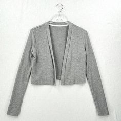 Enza Costa Sweater Womens Medium Gray Cropped Long Sleeve Open Cardigan New Open Design Super Soft Ribbed Knit Long Sleeve No Brand Or Care/Content Tags Hand Wash Condition: New Without Tags, No Flaws Noted. No Brand Or Care/Content Tags Color: Gray Material: Material: 49% Polyester, 48% Viscose, 3% Spandex Bust 17.5" Length 18" - All Measurements Are Taken Flat Across One Side(Unless Otherwise Noted), Please Double To Get The Measurement All The Way Around - Measurments Are Approximate, Please Gray Fitted Cardigan, Long Sleeve Cotton Shrug For Fall, Long Sleeve Cotton Shrug, Fitted Casual Open Front Shrug, Fitted Cotton Open Front Tops, Casual V-neck Shrug For Spring, Spring Open Front Shrug For Layering, Casual Long Sleeve Shrug For Spring, Gray Spring Cardigan For Layering