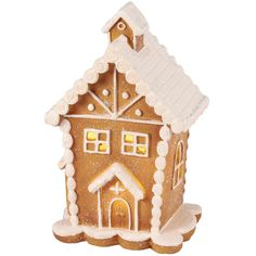 a gingerbread house ornament with snow on the roof