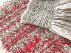 some red and white knitted items on a table