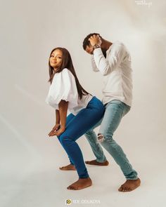 a man and woman are dancing together on a white background in the image is taken from behind