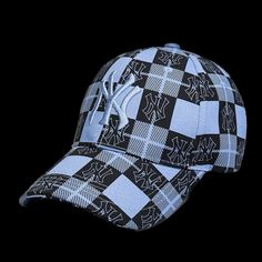 a blue and black baseball cap on a black background