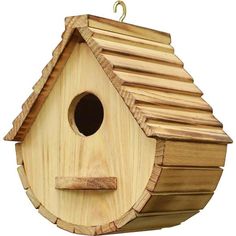 a wooden birdhouse hanging from a hook