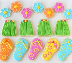 decorated cookies in the shape of shoes and flowers