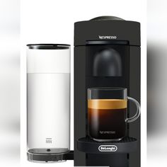 an espresso machine next to a cup of coffee