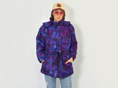 "DESCRIPTION - vintage printed puffy jacket - 2 pockets - hooded - tied waist - newspaper print - shoulder pads - materials: polyester CONDITION (1-10): ❶❷❸❹❺❻❼❽❾ Great condition The model is 5'9\" (174 cm), measures 35-27-38 (90-69-96 cm) and wears size M SIZE/MEASUREMENTS Size from label: S best fits: S/M chest: 49,5 inches (126 cm) waist: 48 inches (122 cm) length: 33 inches (84 cm) sleeve length from armpit: 16,5 inches (42 cm) WE SHIP WORLDWIDE FOLLOW US: instagram.com/gertrudeedvintage/" Retro Purple Outerwear For Winter, Retro Purple Winter Outerwear, Vintage Purple Outerwear For Spring, Vintage Purple Hooded Outerwear, Vintage Purple Outerwear For Outdoor, Cool Windbreakers, Purple Coat, Newspaper Print, Newspaper Printing