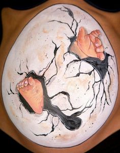 a drawing of two bare feet on top of a cracked white plate with black paint