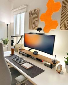 a desk with a computer monitor, keyboard and mouse