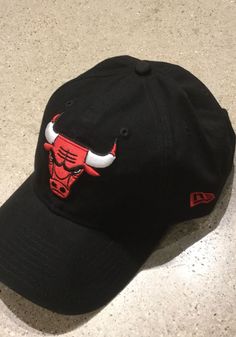 New Era Chicago Bulls Core Classic 9TWENTY Adjustable Hat - Black - 5903388 Curved Bill Hat With Embroidered Logo For Fan Merchandise, Curved Bill Hat With Embroidered Logo For Fans, Dad Cap With Embroidered Logo For Fan Gear, Casual Curved Bill Fitted Hat For Fans, Curved Visor Hat With Embroidered Logo For Fans, Fan Merchandise Hat With Embroidered Logo, Fan Merchandise Cap With Embroidered Logo, Casual Fitted Hat With Custom Logo, Black Dad Hat With Embroidered Logo For Baseball Season