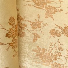 a close up view of a flowered curtain with gold foil on the edges and bottom