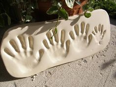 a ceramic planter with handprints on it and the words family matters written below