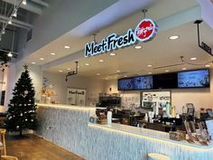 the inside of a fast food restaurant with christmas decorations