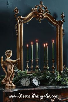 an ornate mantle with candles, angel figurine and clock in front of it