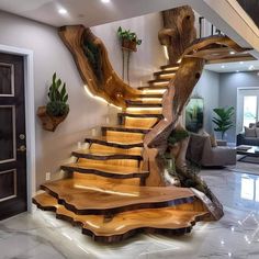 the stairs are made out of wood and have led lights on them as well as plants