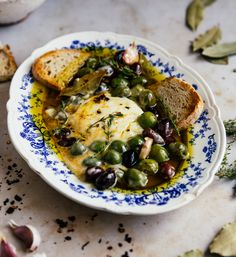 a white plate topped with bread and green beans