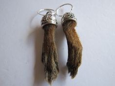 Real Mummified (Cured) Squirrel Foot/Paw Hoop Earrings.  The paws are inside a detailed Tibetan Silver cap.  The earrings measure 3 1/4"" long with the Silver-Plated Hoops. Wearing or carrying animal parts dates back more than 15,000 years and was believed to endow the wearer with the power of the creature. Comes in an Organza Bag along. Makes a nice gift Earrings will last a lifetime with proper care. Not recommended to wear while bathing or swimming. Animal Bone Jewelry, Bone Jewelry, Earrings Hoops, Animal Bones, Silver Caps, Handcrafted Artisan Jewelry, Jewelry Earrings Hoops, Earring Gifts, Artisan Jewelry