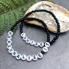 A super cute plain black name bracelet with your choice of wording and size! Personalise it with your name, your child's name, an inspirational word, your team name, a pet name, a nickname, or anything else you can think of eg Best Nanny, Bridesmaid, or an anniversary date or birth date. Why not get one for yourself and one for your bestie?The custom made bracelet has 4mm glass seed beads and flat white acrylic letter beads, which are 7mm diameter. The seed beads are plain black, meaning you can Personalized Black Friendship Bracelets With Round Beads, Black Beaded Bracelets With Letter Beads For Friendship, Casual Black Stretch Bracelet With Letter Beads, Black Letter Beads Friendship Bracelets, Personalized Black Beaded Bracelet As Gift, Personalized Black Beaded Bracelets As Gift, Personalized Black Beaded Bracelets For Gift, Black Stretch Bracelet With Letter Beads And Round Beads, Black Friendship Bracelets With Letter Beads