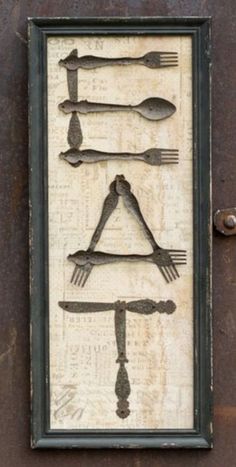 a sign with forks, spoons and knives on it