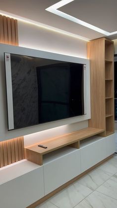 a flat screen tv mounted to the side of a wall