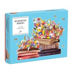 a book that is sitting on top of books with butterflies coming out of the pages